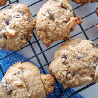 Coconut Quinoa Chocolate Chip Cookies on a black cooling rack.