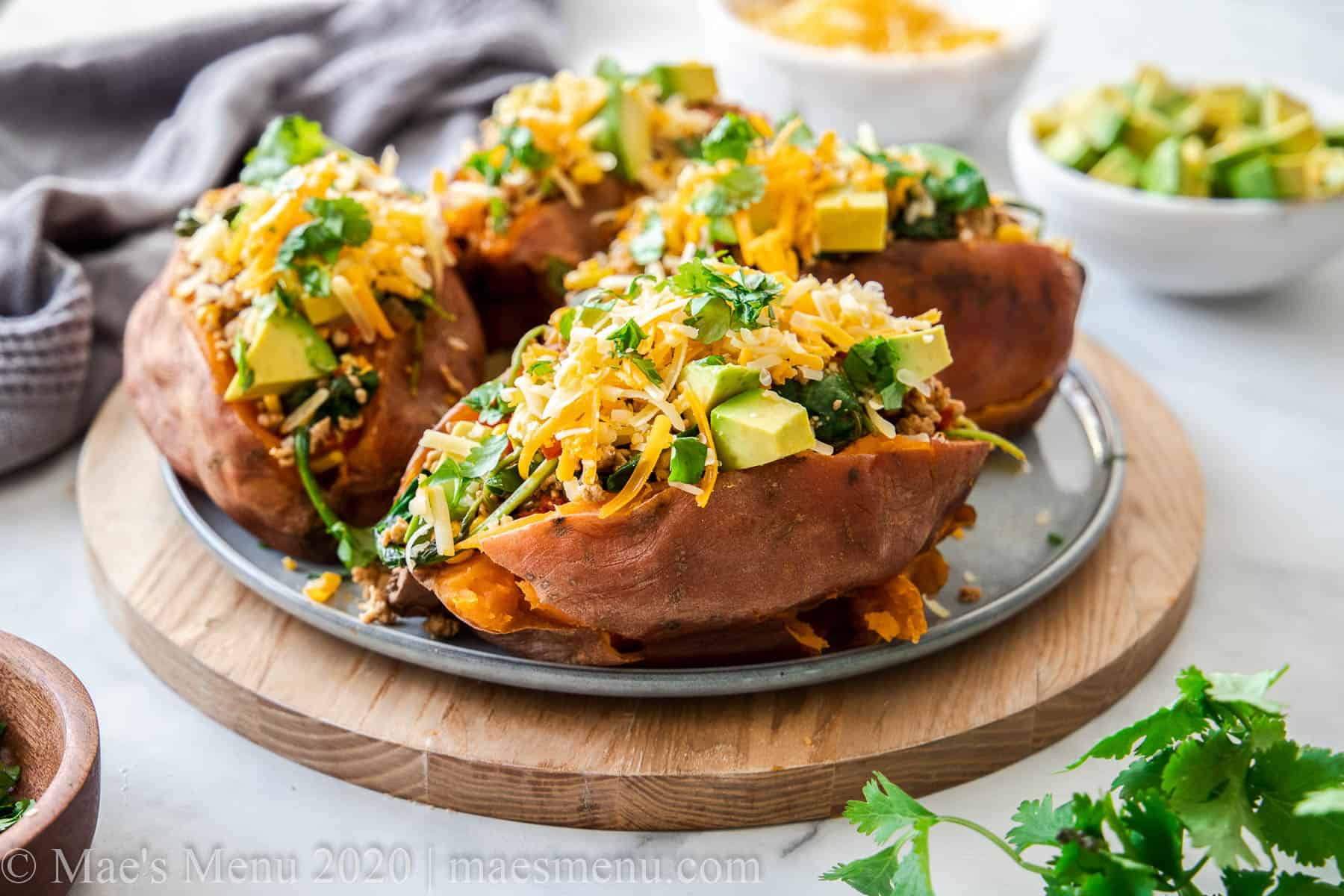 A large platter of taco stuffed sweet potatoes.