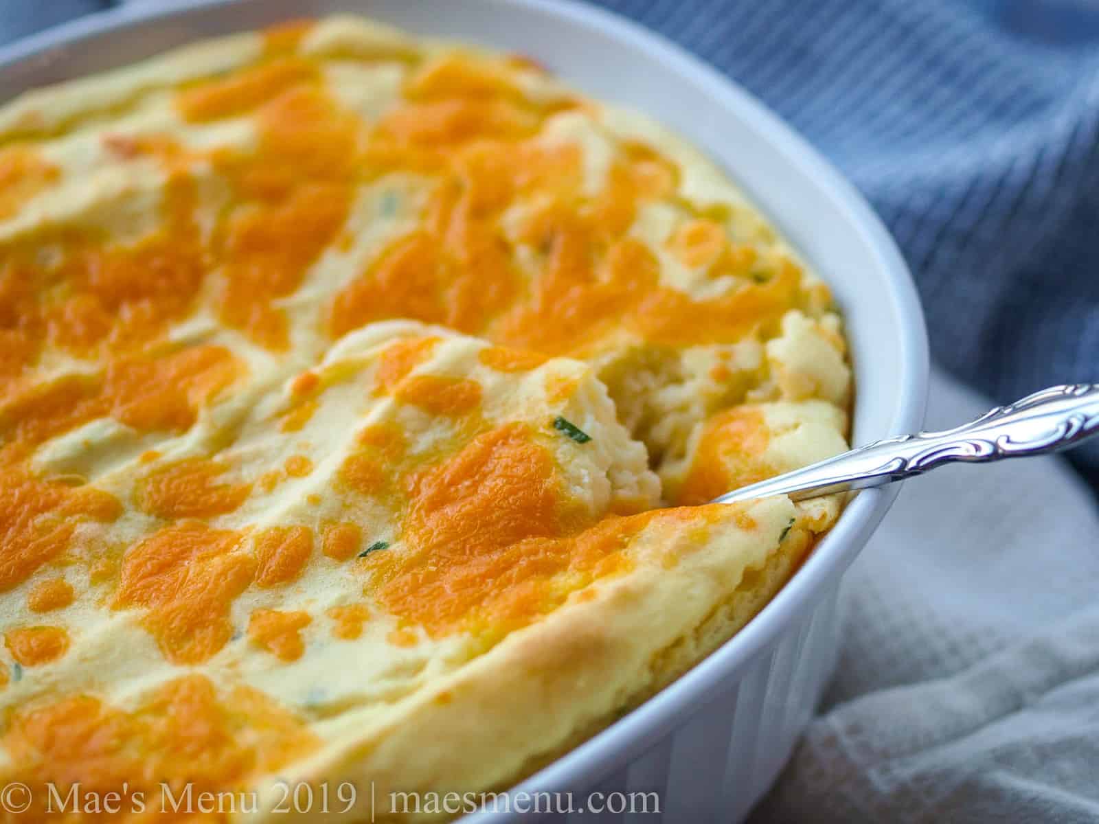 Up-close shot of potato casserole with sour cream and chives