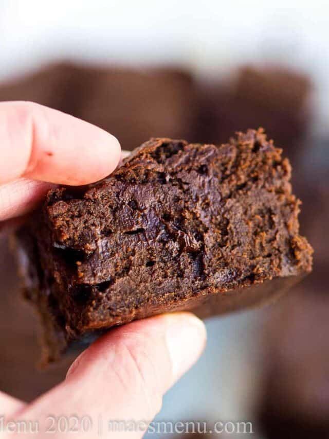 Hand holding a date brownie.