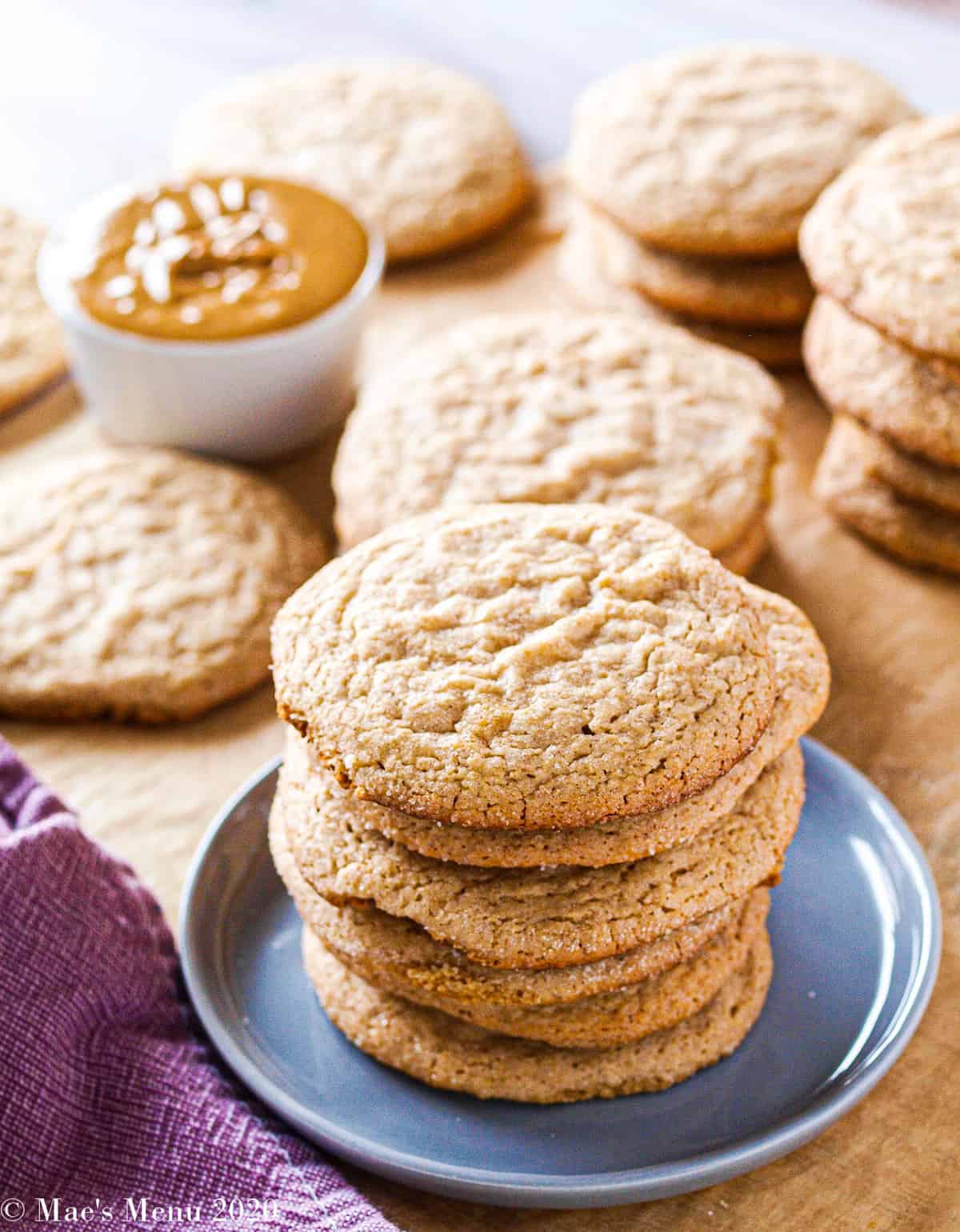 Multiple pies of peanut butter cookies on a wooden table