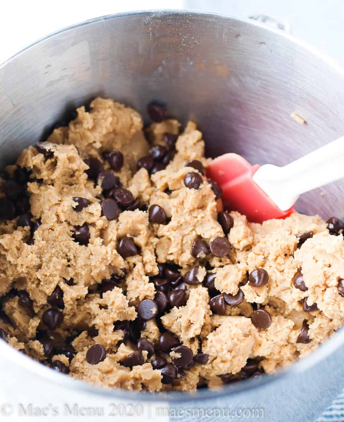 A bowl of chocolate chip cookie batter. 