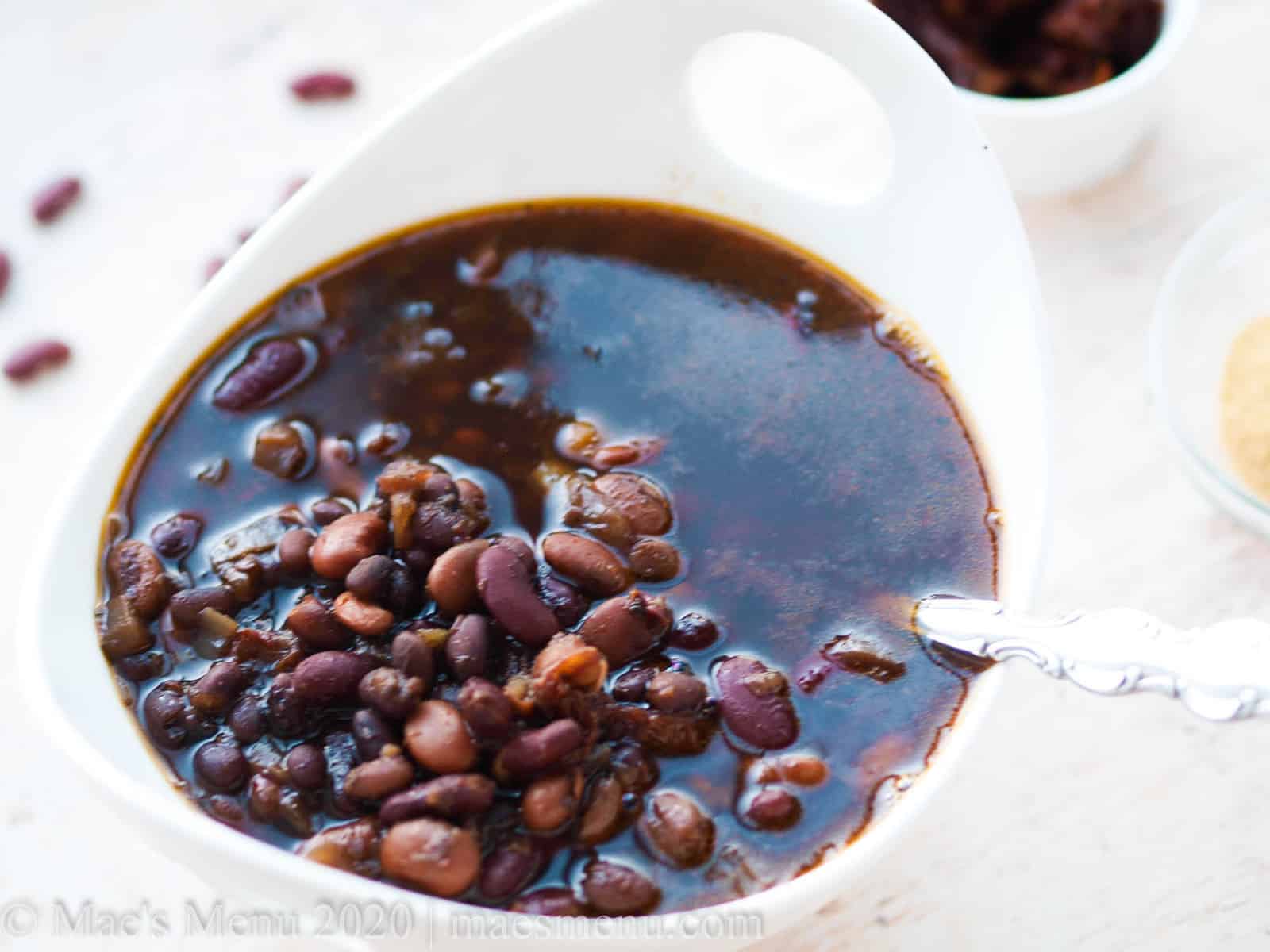 A large bowl of pressure cooker maple baked beans.
