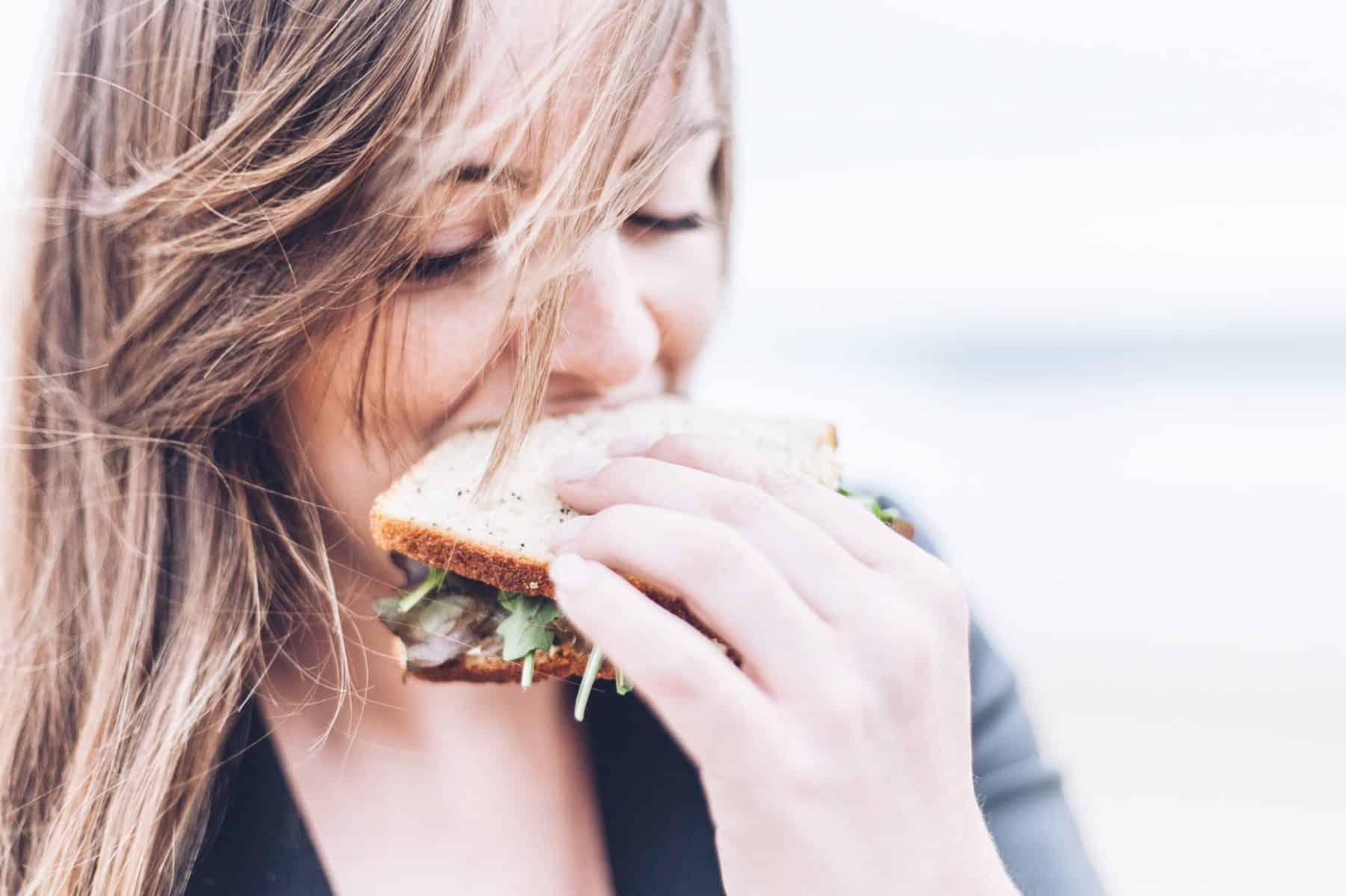 A woman eating a sandwich