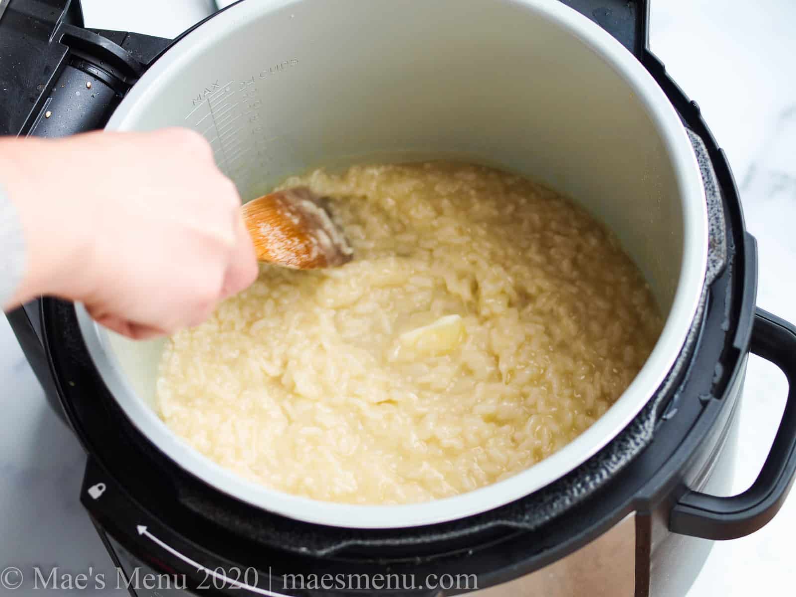 Stirring butter into the rice in the instant pot