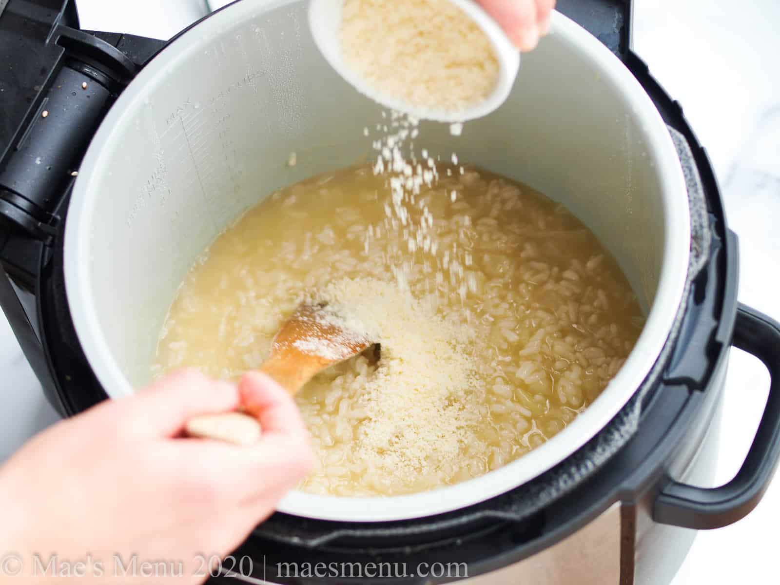 Sprinkling cheese over the rice in the instant pot 