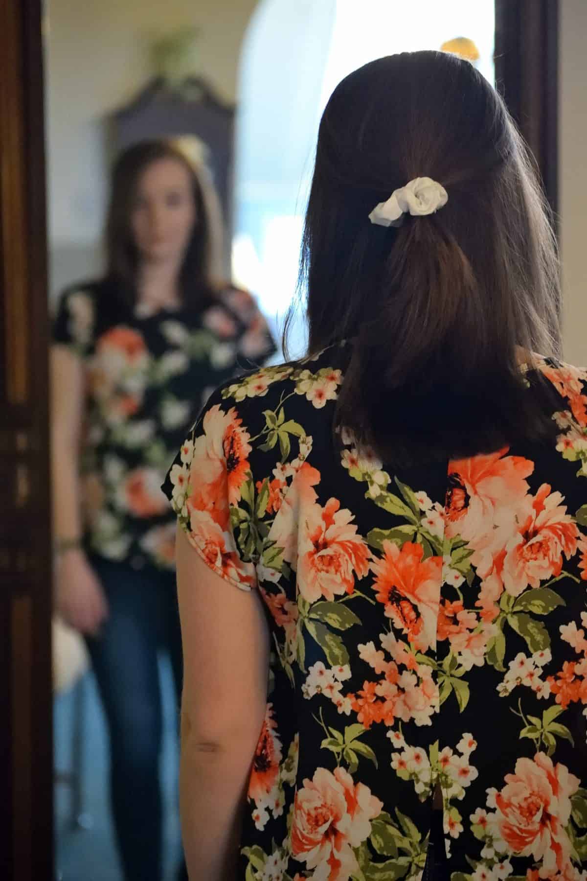 A lady looking in the mirror 
