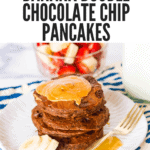 Pinterest pin for gluten-free banana double chocolate chip pancakes . A stack of chocolate pancakes with gooey peanut butter, bananas, and chocolate chip