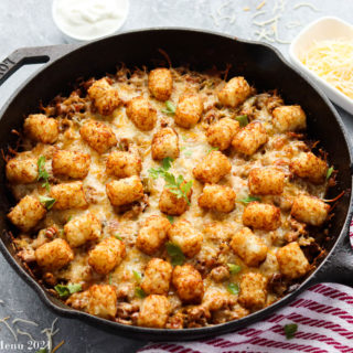 An overhead shot of a skillet of tacto tater tot casserole