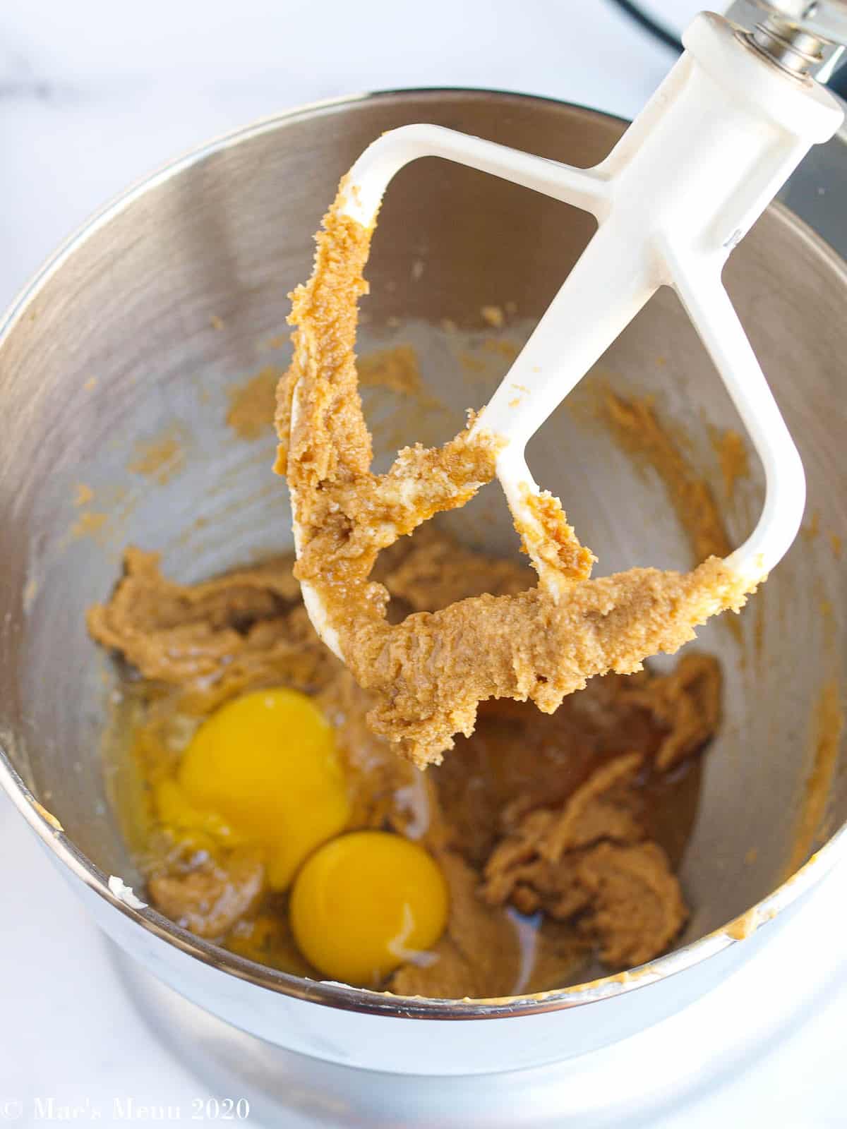 Peanut butter, butter, sugars, and eggs mixed up in a stand mixer