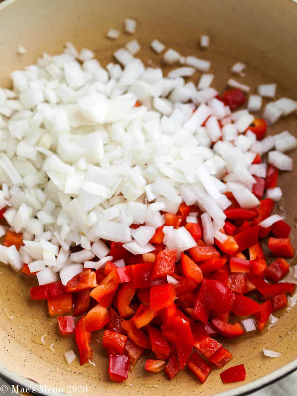 Onions and peppers in a saute pan
