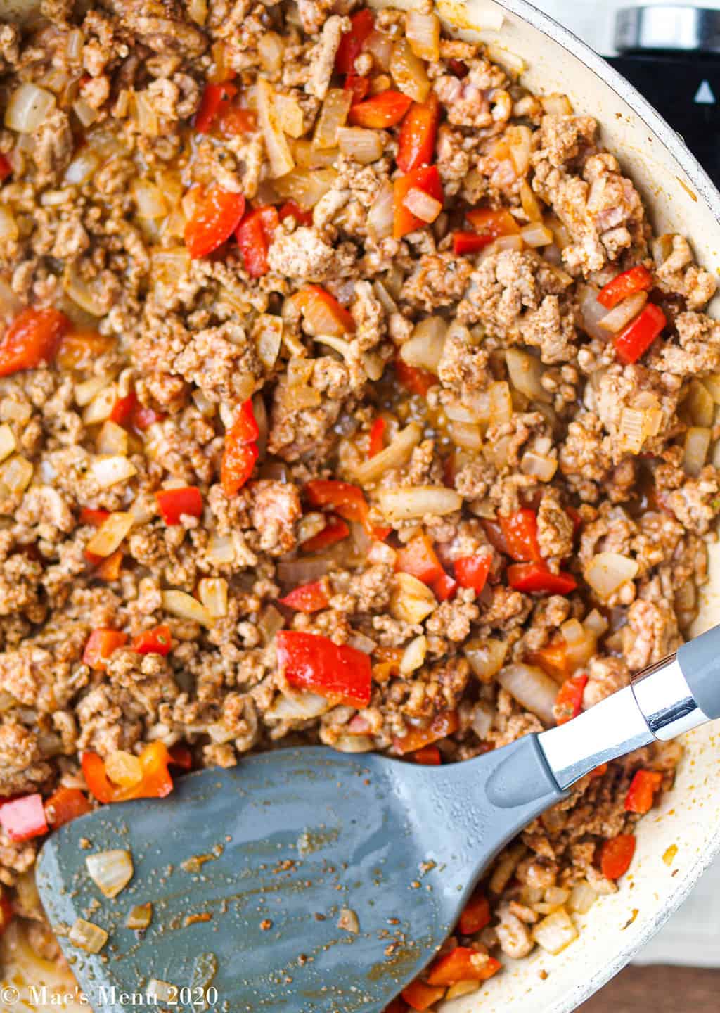 Cooked taco meat with peppers and onions 