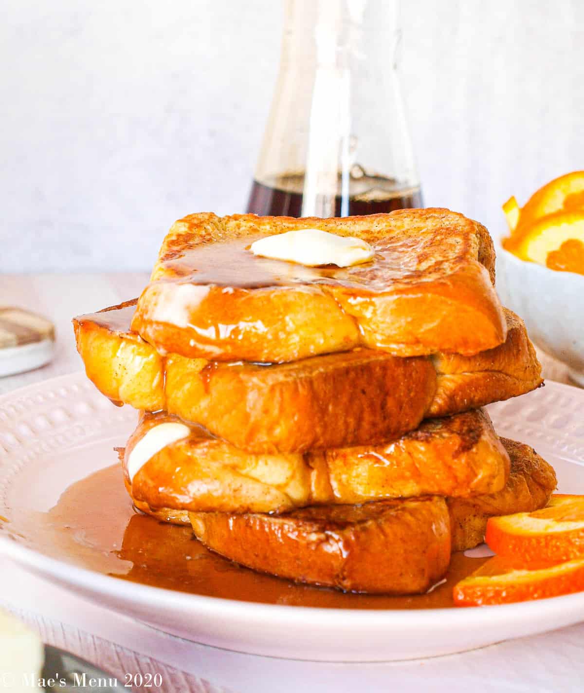 An up-close shot of a large stack of brioche french toast