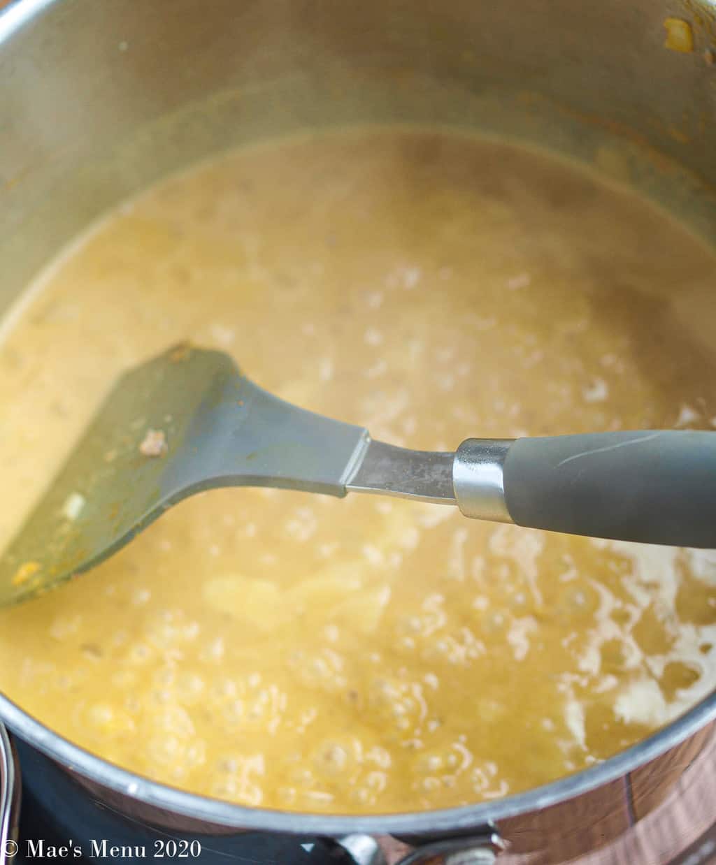The simmering peanut butter curry sauce