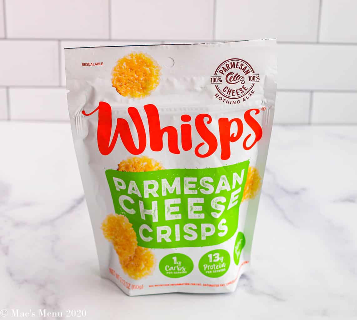 A bag of Whisps parmesan cheese crisps on the counter