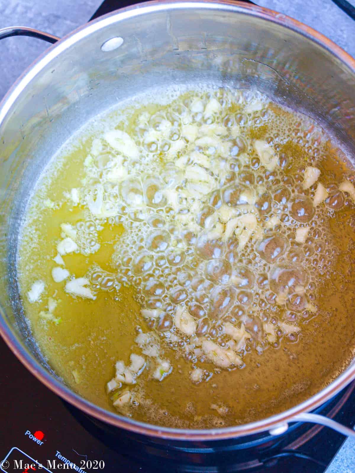 Sauteing garlic in a stockpot