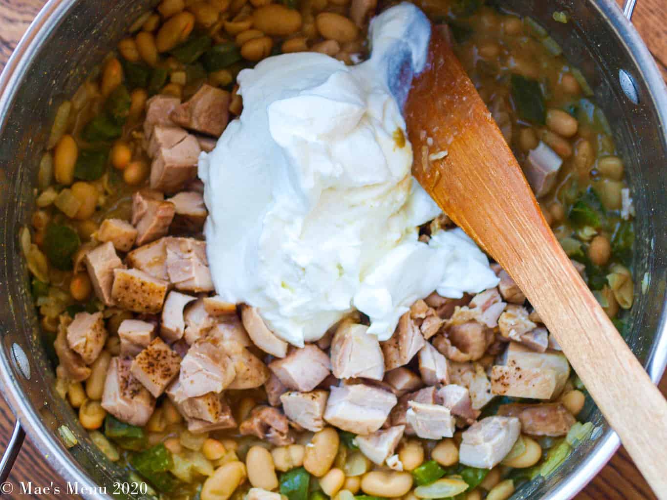 Beans, veggies, turkey, and greek yogurt in a pot