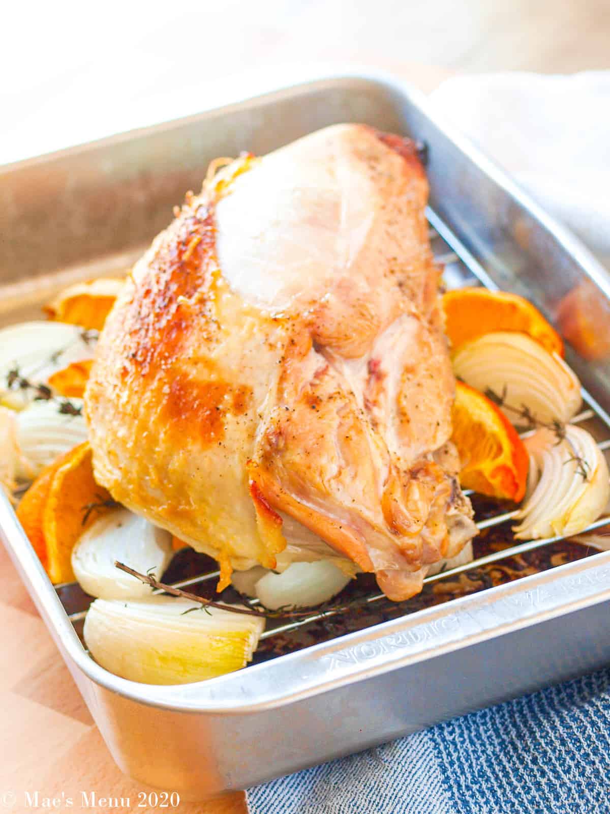 A turkey breast in a roasting pan.