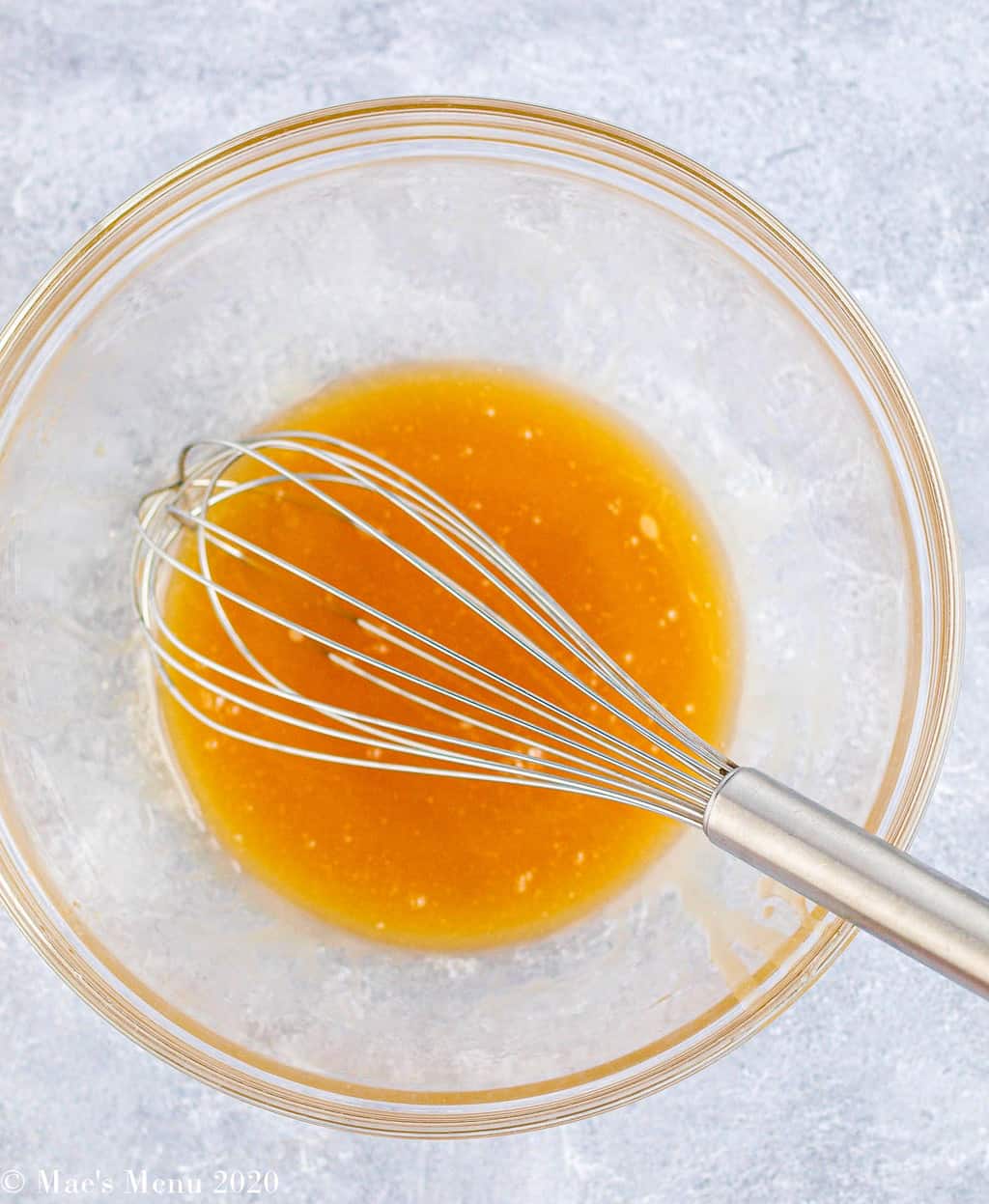 Melted honey and butter in a mixing bowl