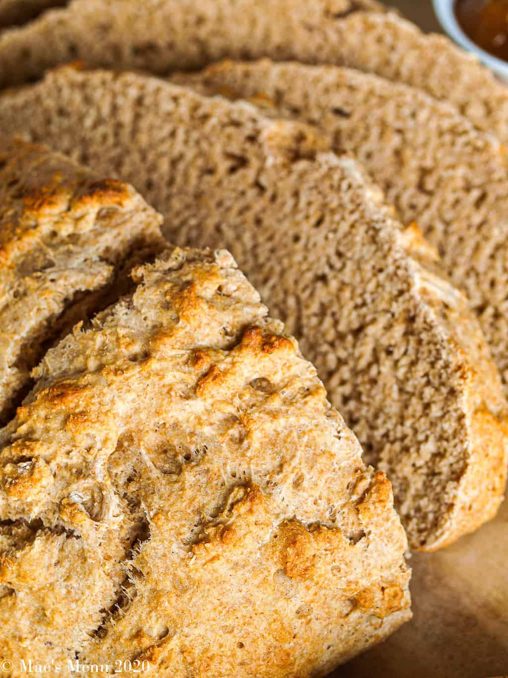 An up-close shot of a sliced loaf of beer bread