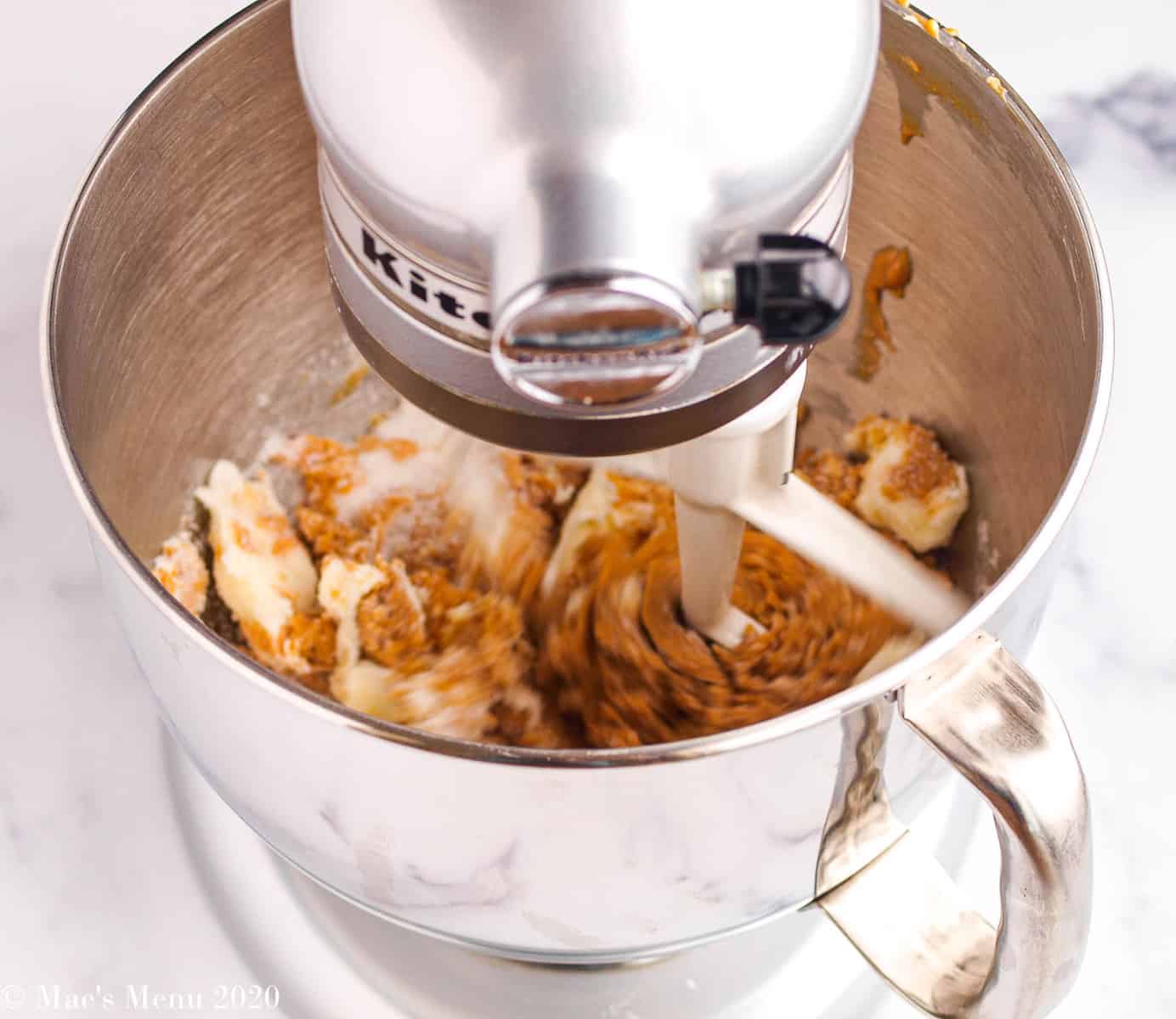Whipping the butter, peanut butter, and sugar in a stand mixer