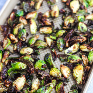 A large gold pan of air fryer brussels sprouts