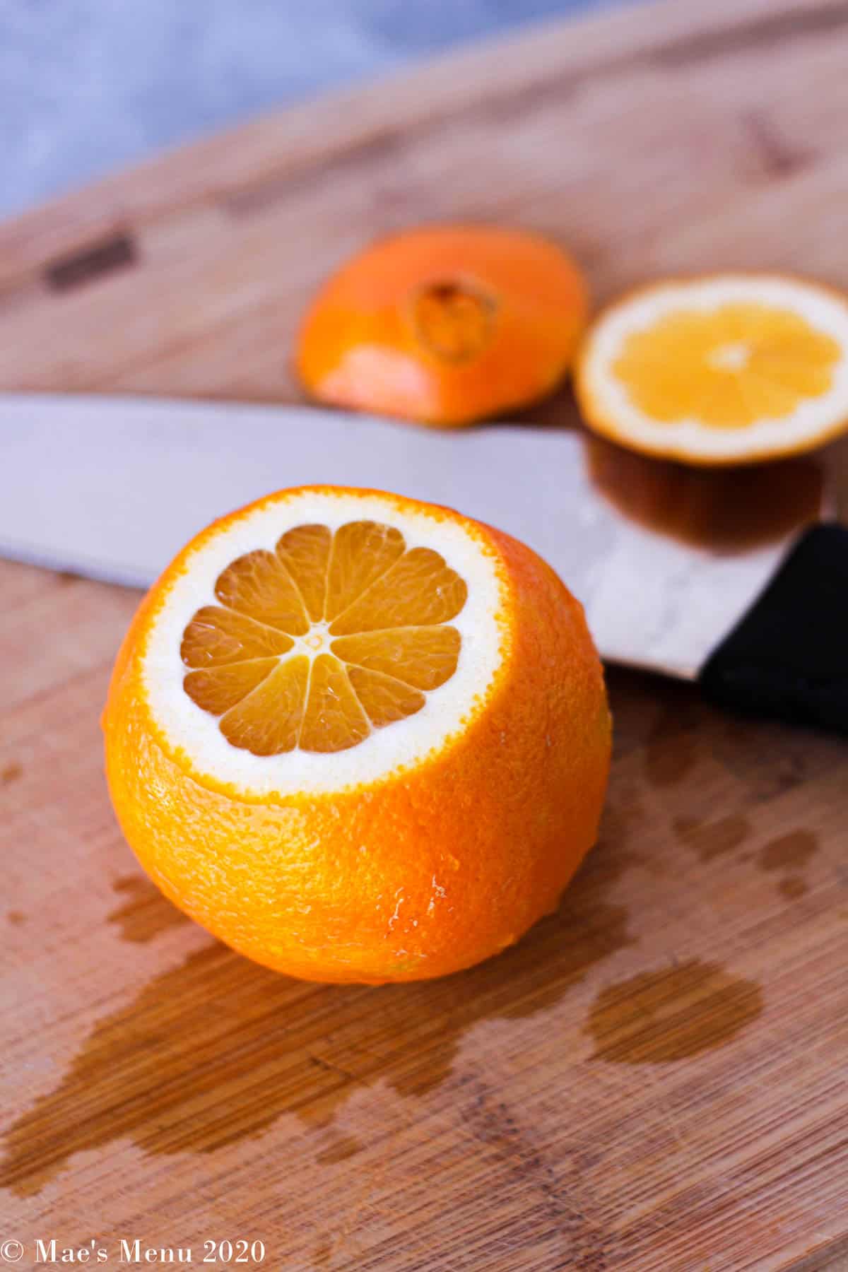 An orange with the top and the bottom cut off