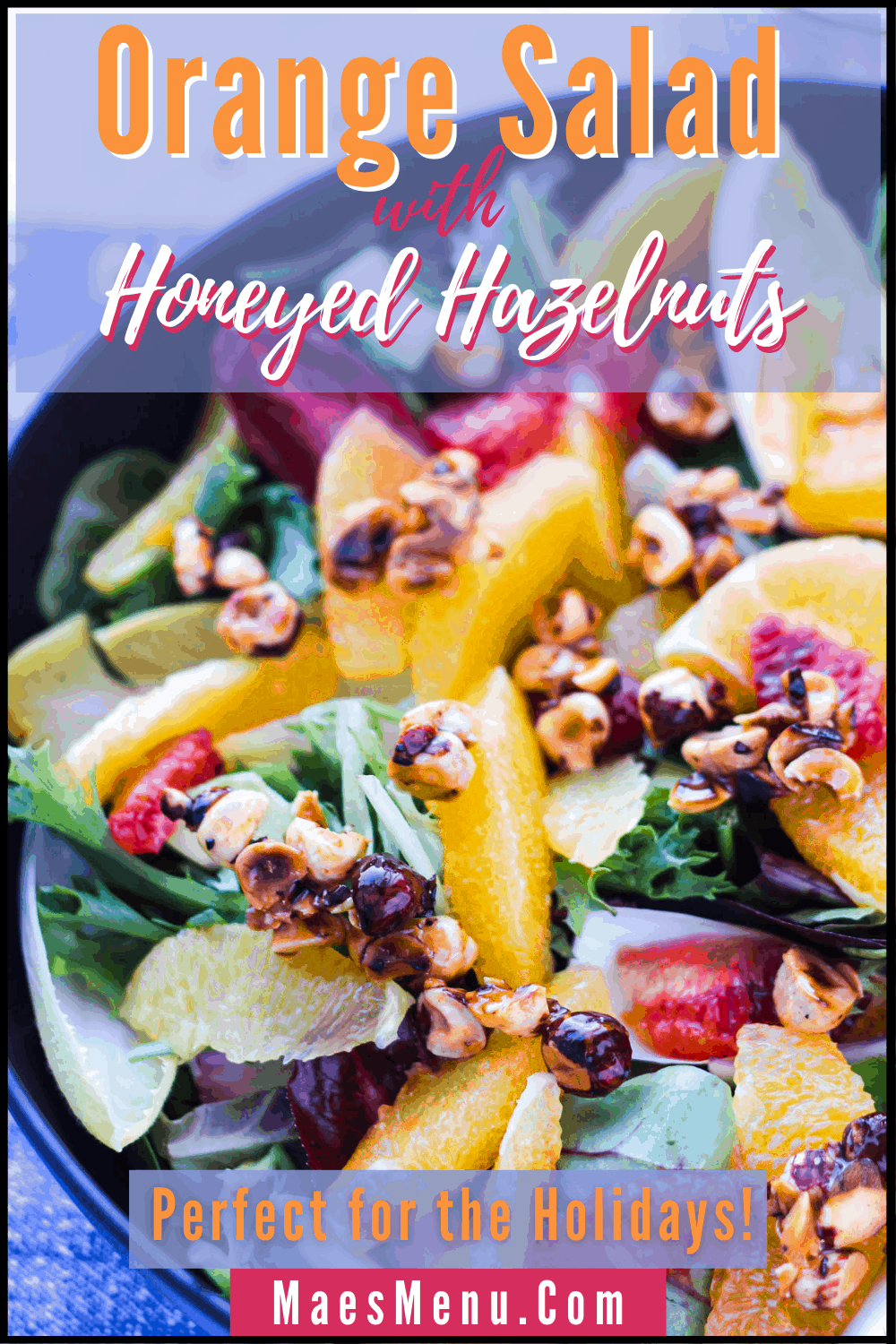 A pinterest pin for orange salad with honeyed hazelnuts. On the image is an up-close shot of the salad