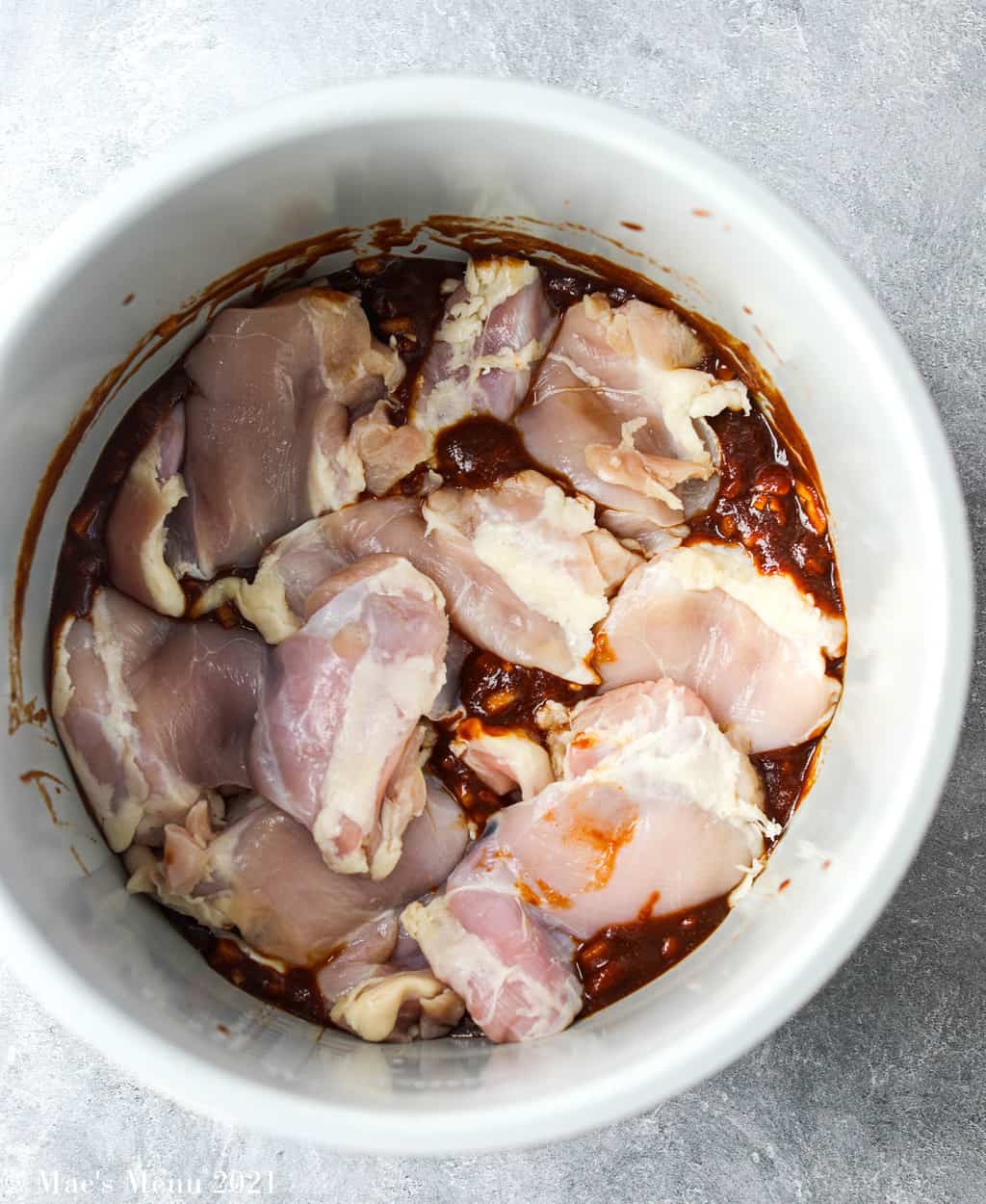 Nestling the chicken into the bbq sauce in the instant pot 