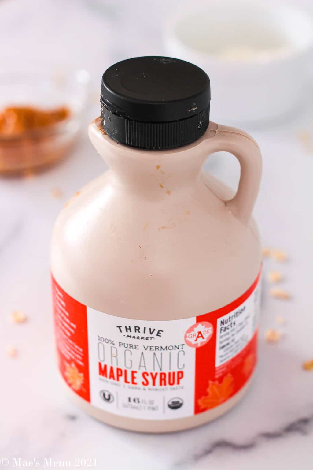 An up-close shot of  a bottle of thrive market maple syrup
