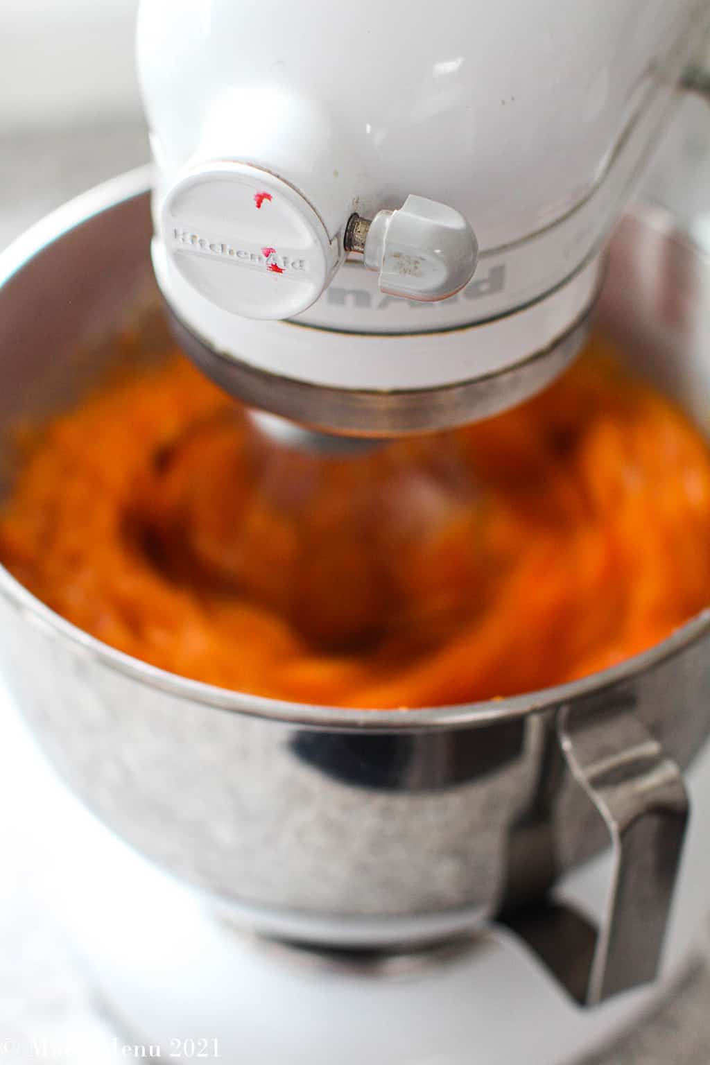 The stand mixer running on high, whipping up the sweet potato souffle
