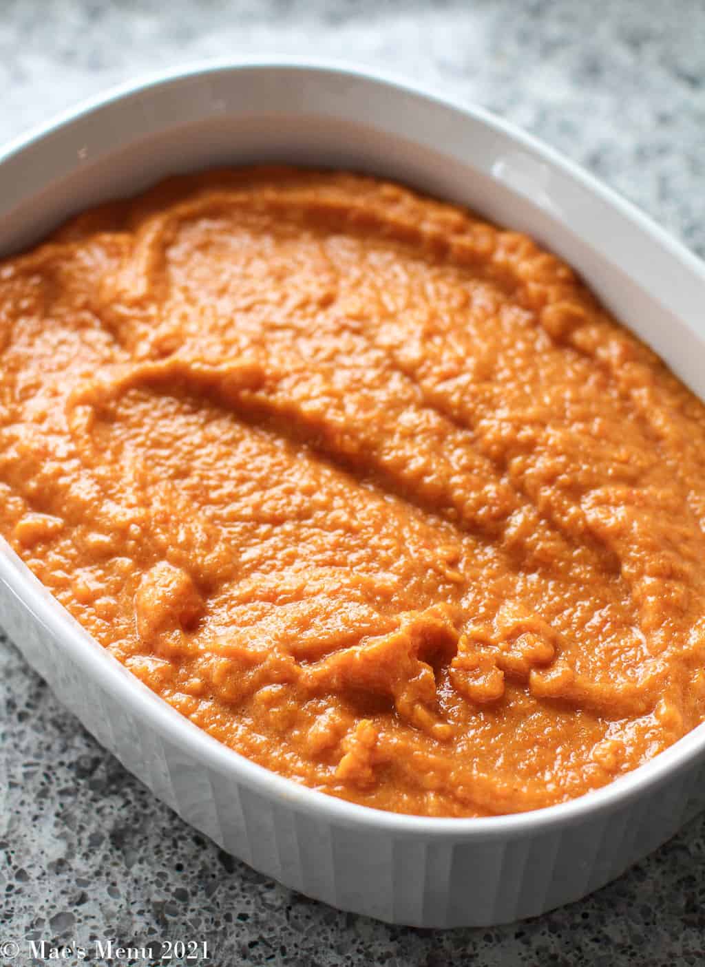 Sweet potato souffle in a baking dish ready to go in the oven