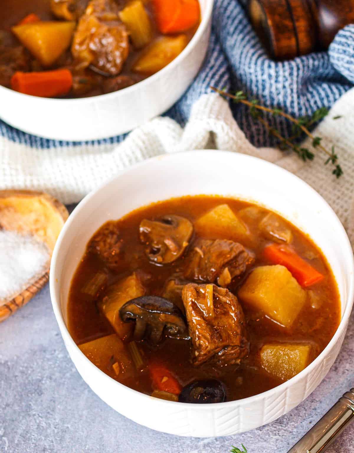 An up-close shot of two bowls of beer beef stew 