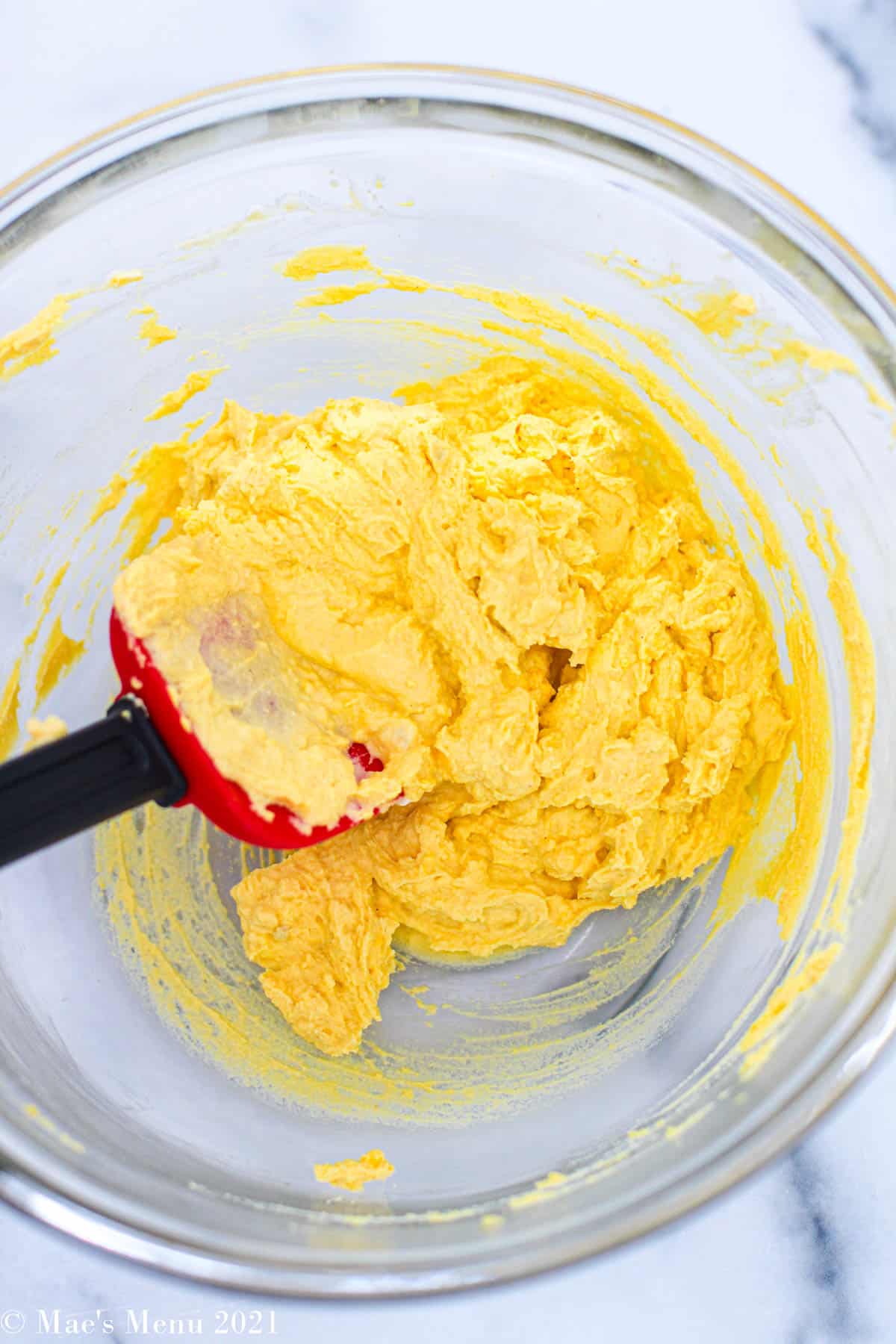 The egg yolk mixture in a mixing bowl