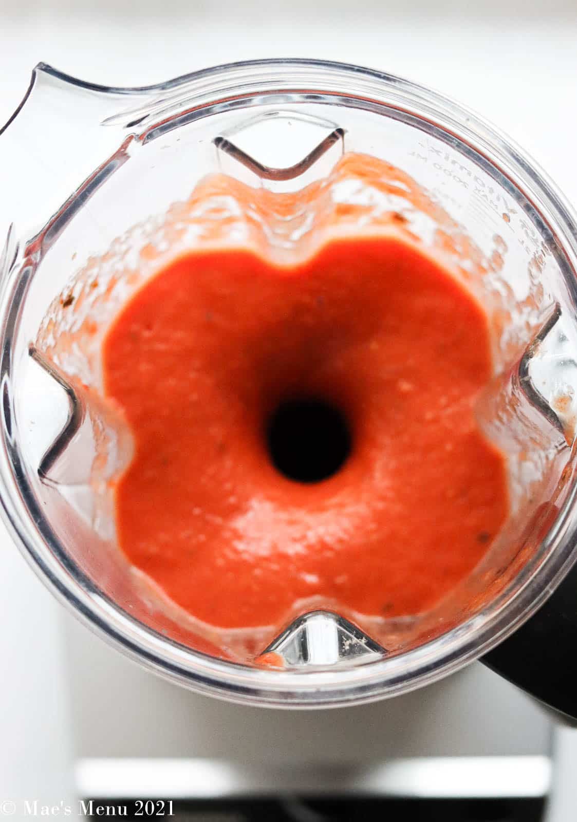 Marinara sauce blending up in a blender