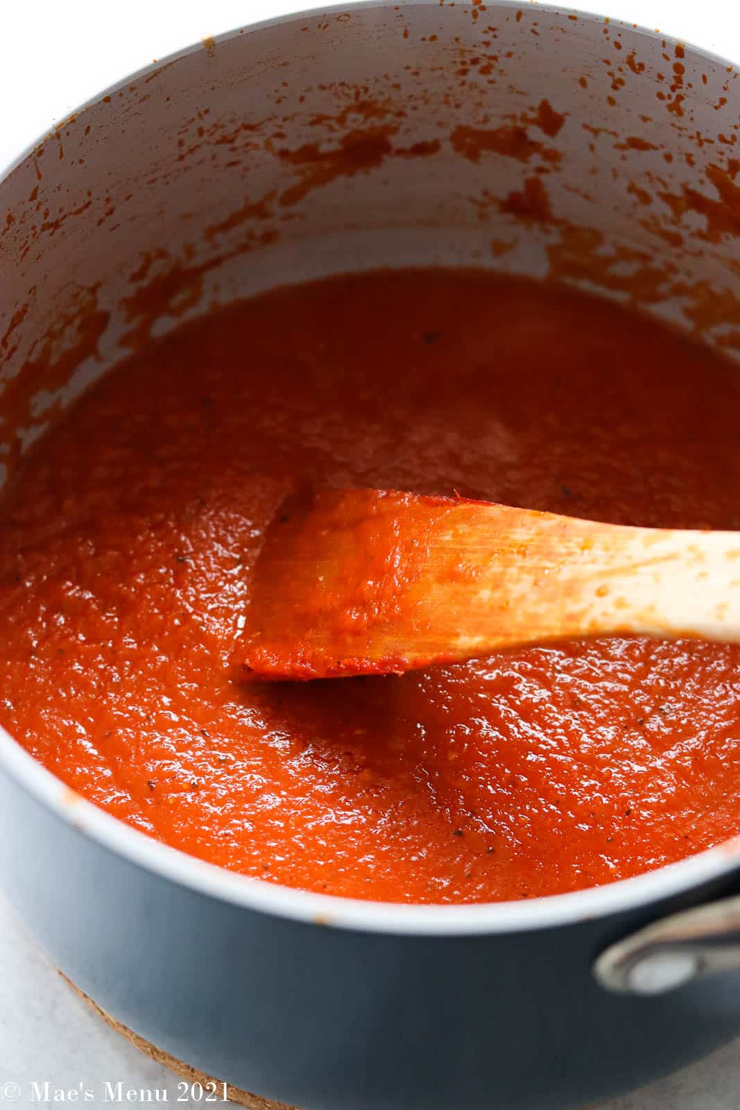 An overhead shot of a large saucepan of homemade pasta sauce