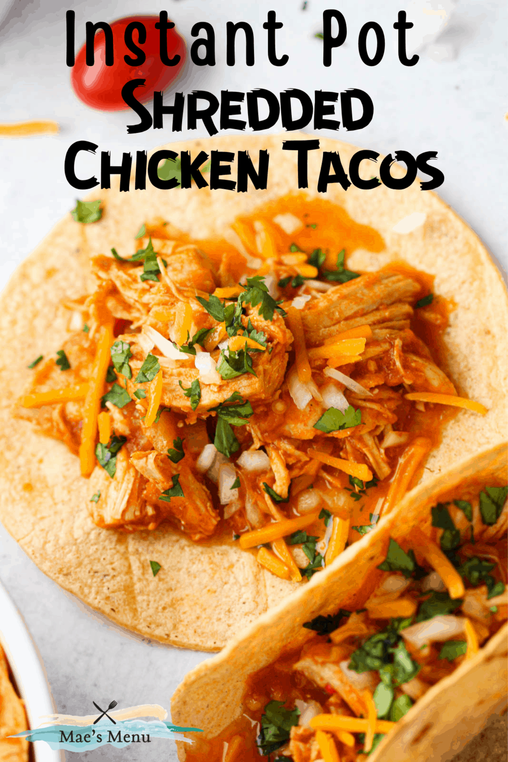 a pinterest pin for an up-close overhead shot of an instant pot shredded chicken taco