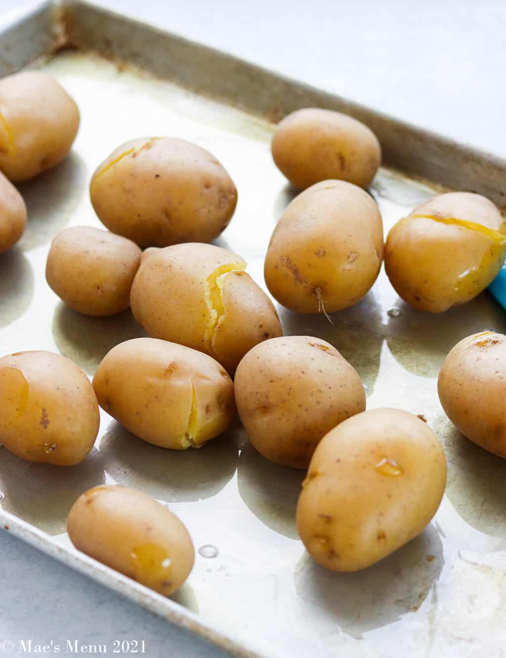 boiled potatoes on a baking sheet