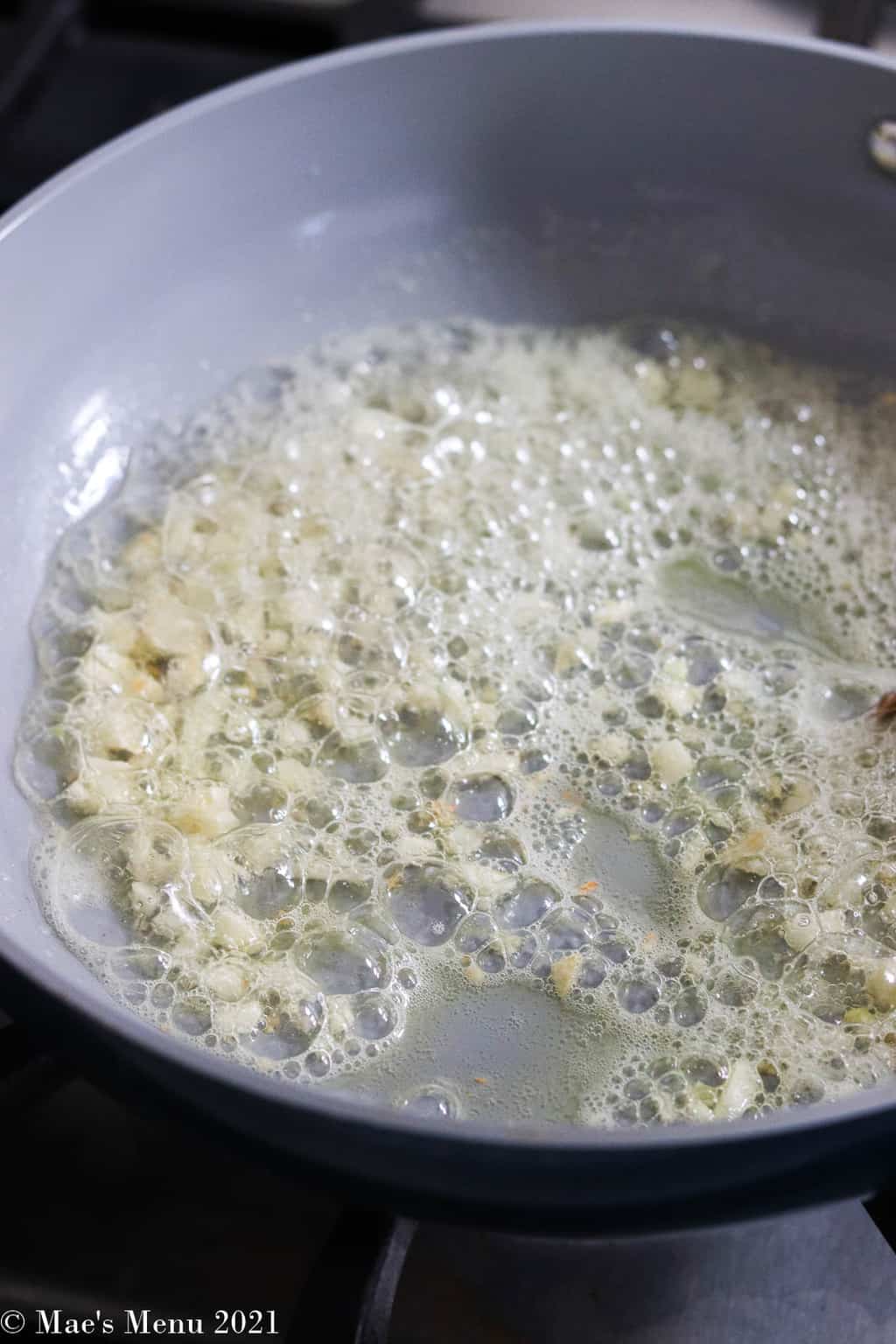 sauteing garlic in a pan