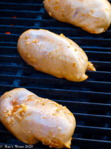 Grilling the chicken on the grill