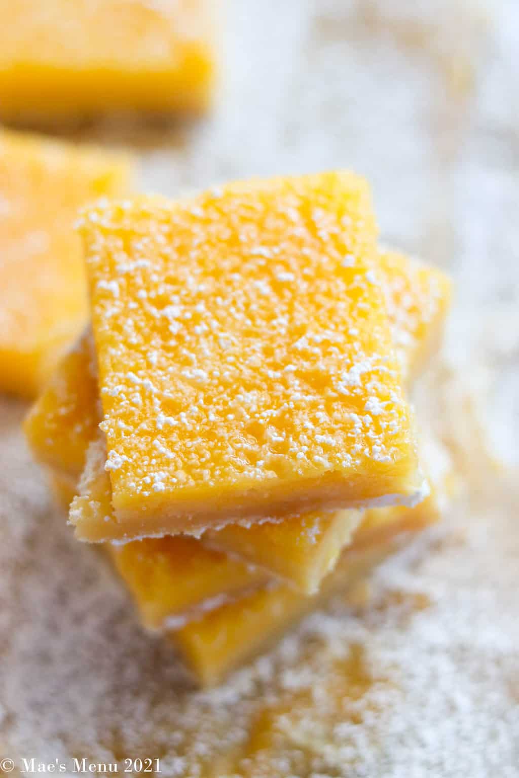An up-close overhead shot of a stack of lemon bars 