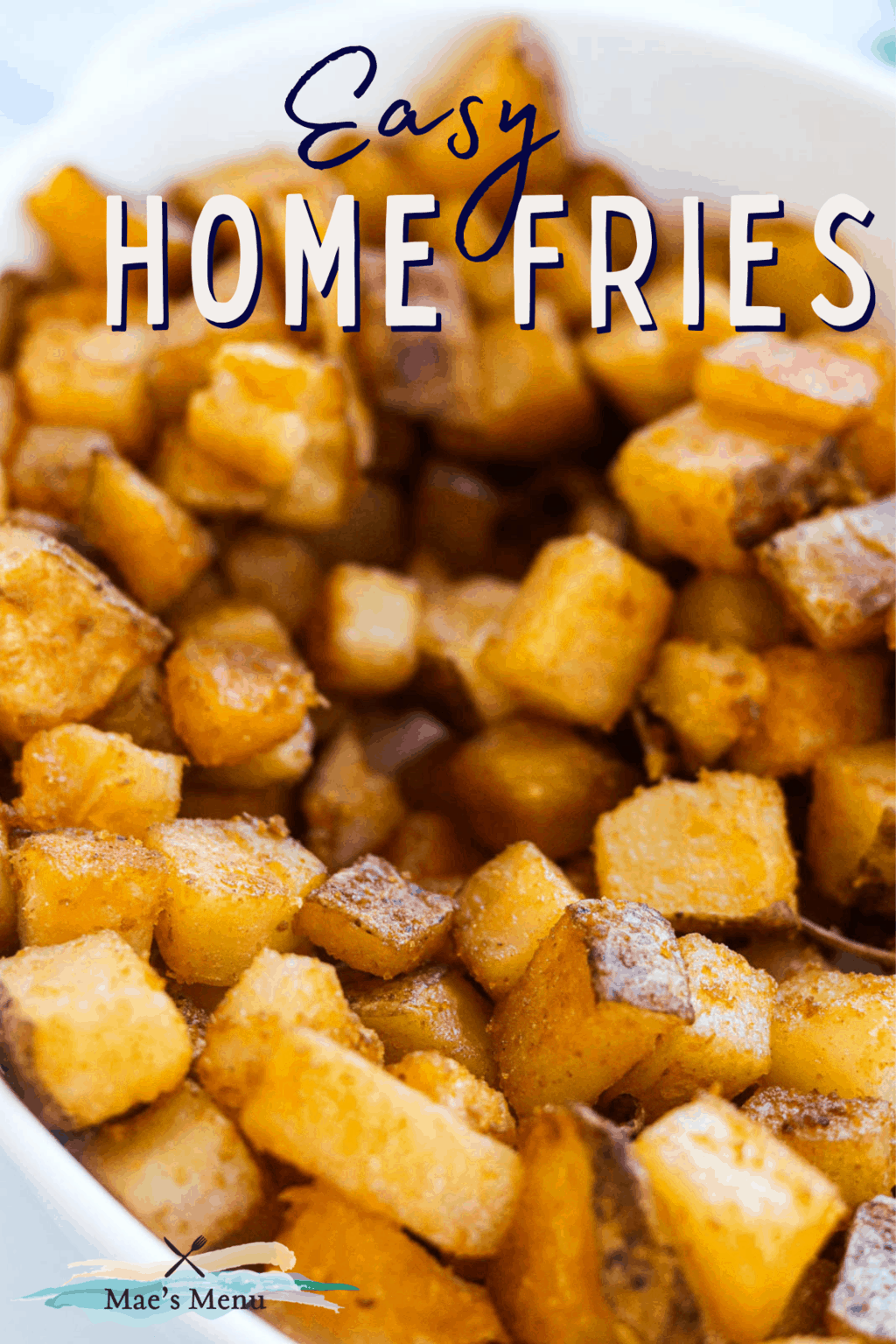 Pinterest pin for easy home fries with an up close shot of the home fries in a bowl 
