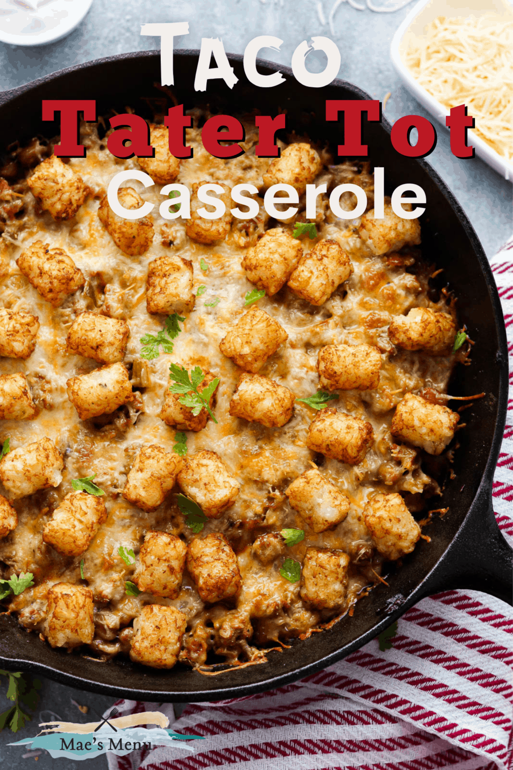 A pinterest pin for taco tater tot casserole with an overheat shot of a pan of the casserole 