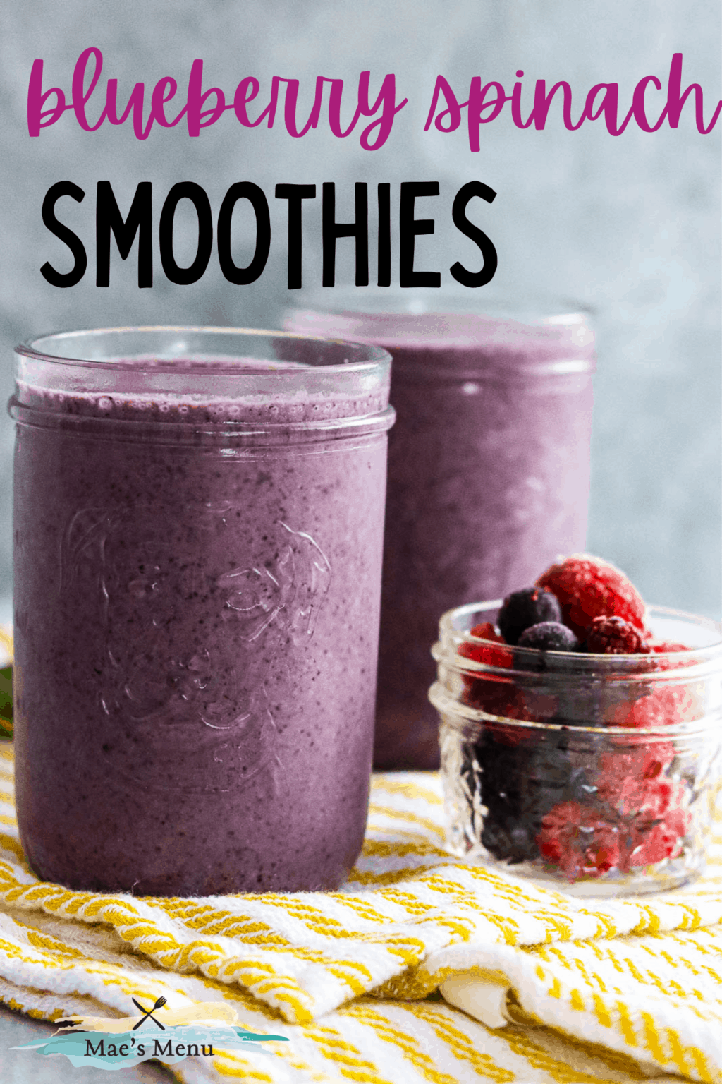 A pinterest pin for blueberry spinach smoothies with a side shot of two cps of the smoothie