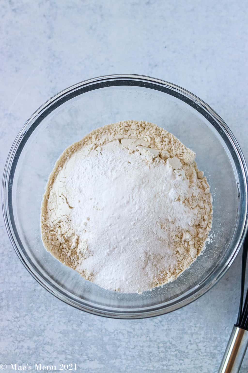 Flour and the rest of the dry ingredients in a glass mixing bowl