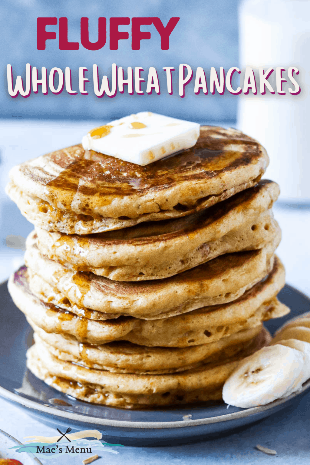 A pinterest pin for fluffy whole wheat pancakes with an upclose photo of the pancakes