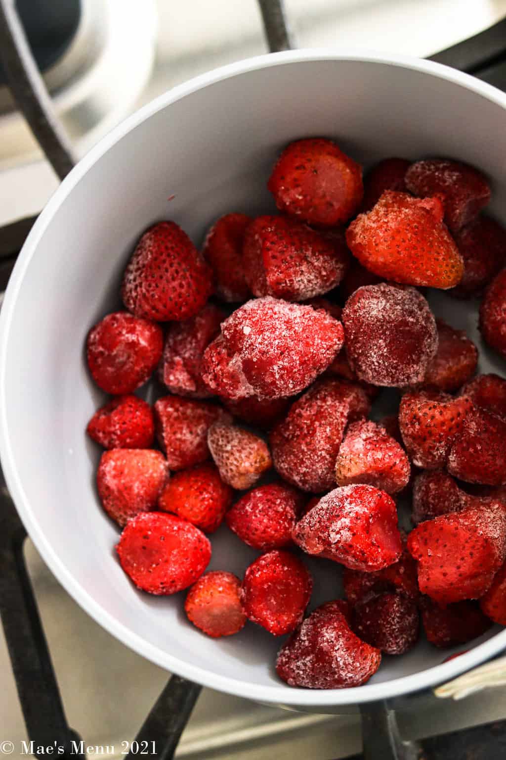 frozen strawberries in a saucepan
