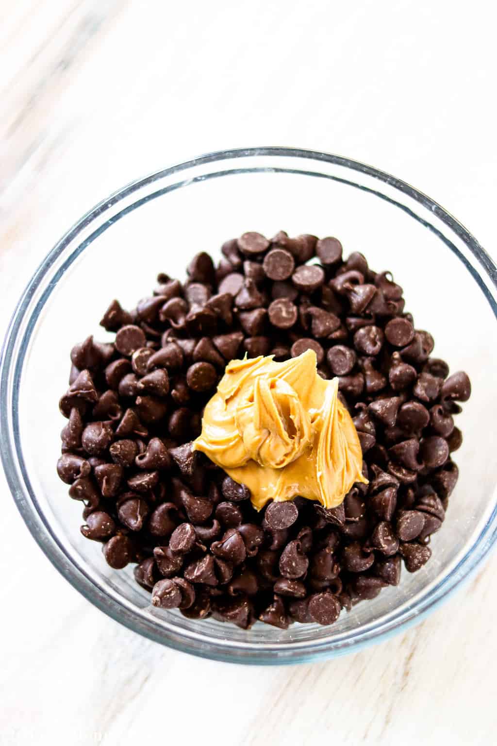 Chocolate chips and peanut butter in a small mixing bowl