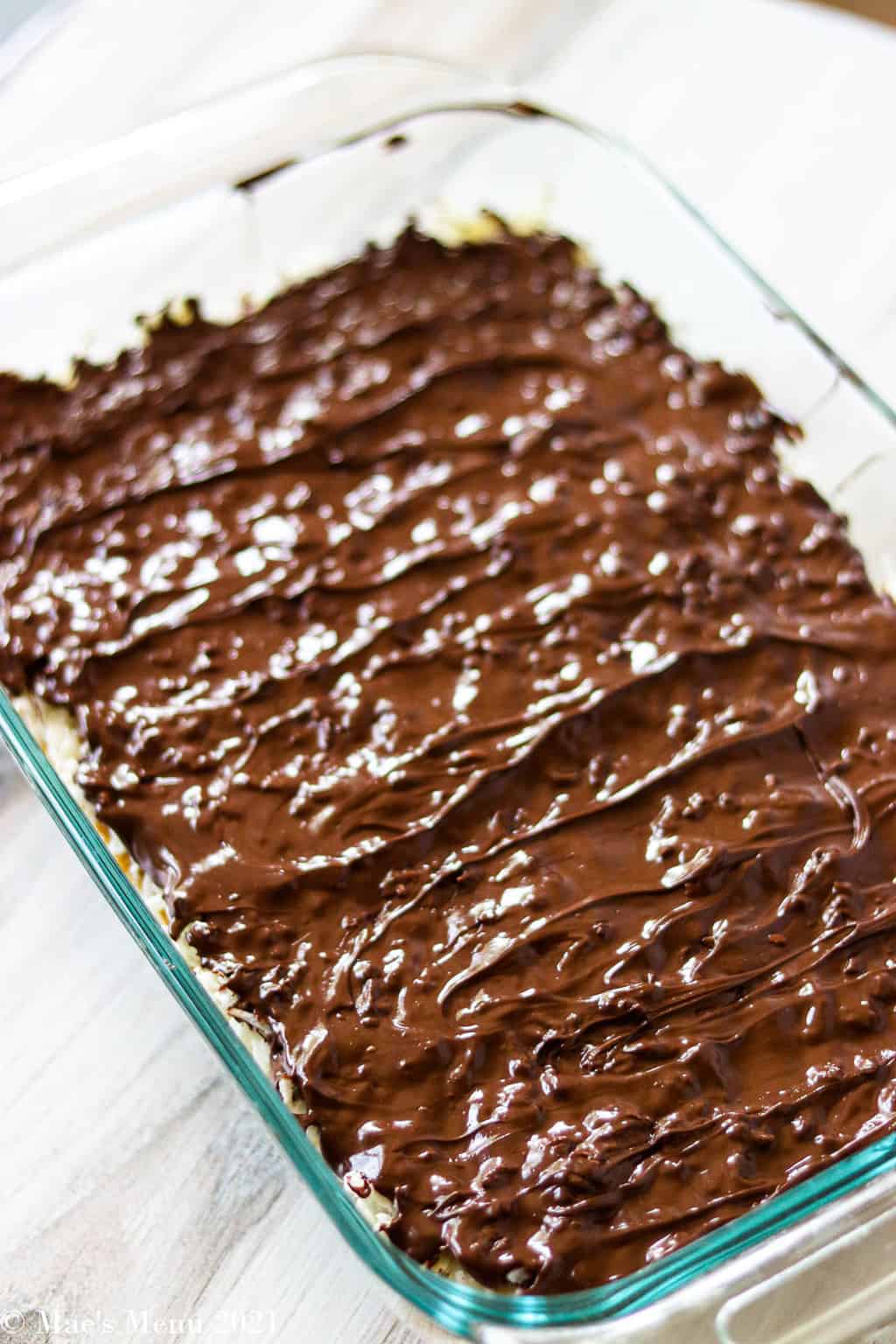 A baking pan of chocolate coconut bars before they've cooled