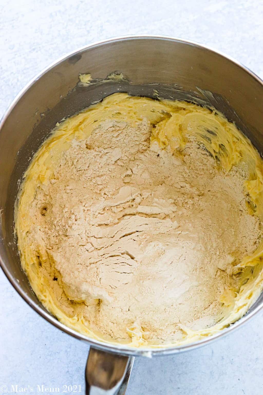 A mixing bowl with creamed butter and flour